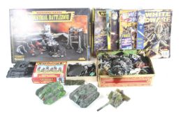 A mixed collection of Warhammer 40K figures and vehicles.