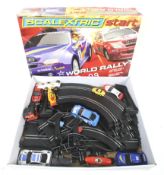 A World Rally Scalextric set. Complete with track and controllors, sold with extra cars, boxed.
