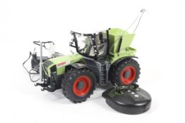 A Dickie Spelzug Claas Xerion remote control tractor. Complete with controller in original box.