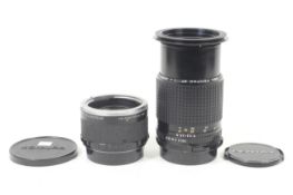An SMC Pentax 67 200mm f4 lens and Komura Telemore95 teleconverter. Lens serial no. 8711556.