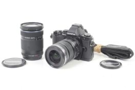 An Olympus OM-D E-M5 Mirrorless Digital camera outfit. With two lenses; an Olympus 12-50mm f3.5-6.