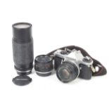 An Asahi Pentax ME Super 35mm SLR camera outfit. With three lenses; an SMC Pentax-M 50mm f1.