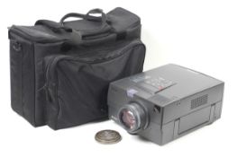 An Epson EMP-7100 LCD projector. Together with cables and carry bag.