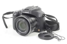 A Panasonic Lumix DMC-FZ72 Digital camera. With two batteries, strap and Hama camera pouch.