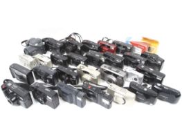 An large assortment of mostly 35mm compact point and shoot cameras.