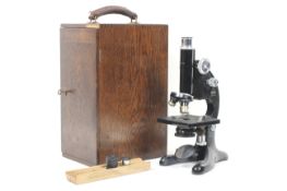An R & J Beck London Model 29 microscope. Black. Patent No. 336063.