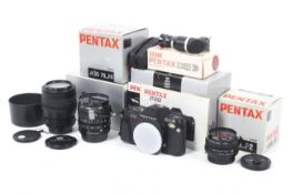 A Pentax P30 35mm SLR camera outfit.