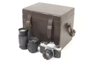 An Asahi Pentax K1000 35mm SLR camera. With an SMC Pentax-M 50mm f2 lens. Chrome body, Serial No.