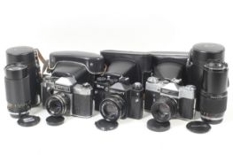 An assortment of cameras and accessories.
