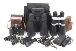 An assortment of six binoculars and a monocular.