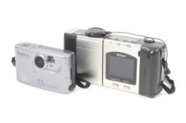 Two compact digital cameras.