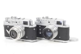 Two Zorki 4 35mm rangefinder cameras.