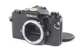 A Nikon FE 35mm SLR camera body. Black. Serial No.