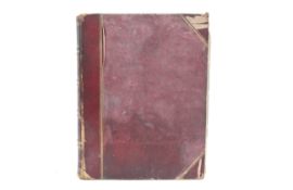 A red leather album of Victorian albumen photographs.