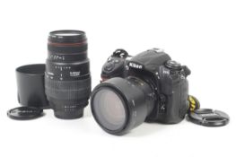 A Nikon D300s Digital SLR camera outfit. With two lenses; a Nikon 18-70mm f3.5-4.