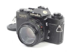 A Minolta XD7 35mm SLR camera. Black. With a Minolta 50mm f1.7 MD Rokkor lens.