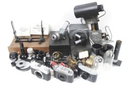 A large assortment of microscope accessories.
