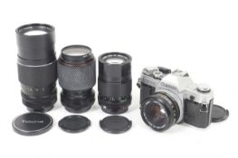A Canon AT-1 35mm SLR camera outfit. With four lenses; A Canon FD 50mm f1.8 S.