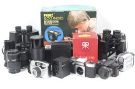 A large assortment of cameras and optical equipment.