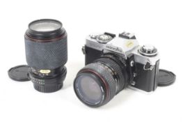 A Minolta XD7 35mm SLR camera outfit. With two lenses; a Tokina SD 28-70mm f3.5-4.