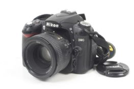 A Nikon D90 Digital SLR camera. With a Nikon 50mm f1.