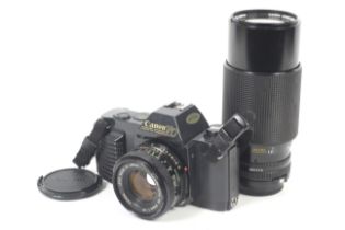 A Canon T50 35mm SLR camera outfit. With two lenses; Canon FD 50mm f1.8 and a Canon FD 70-210mm f4.