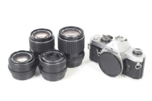 An Asahi Pentax MX 35mm SLR camera outfit. To include four SMC Pentax-M lenses; 35mm f2.8, 50mm f1.