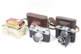 Two film cameras and a flash unit. To include a FED 3 35mm rangefinder camera with a 52mm f2.