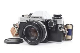 An Olympus OM10 35mm SLR camera. With an Olympus OM 50mm f1.