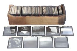 A collection of glass photographic magic lantern slides.