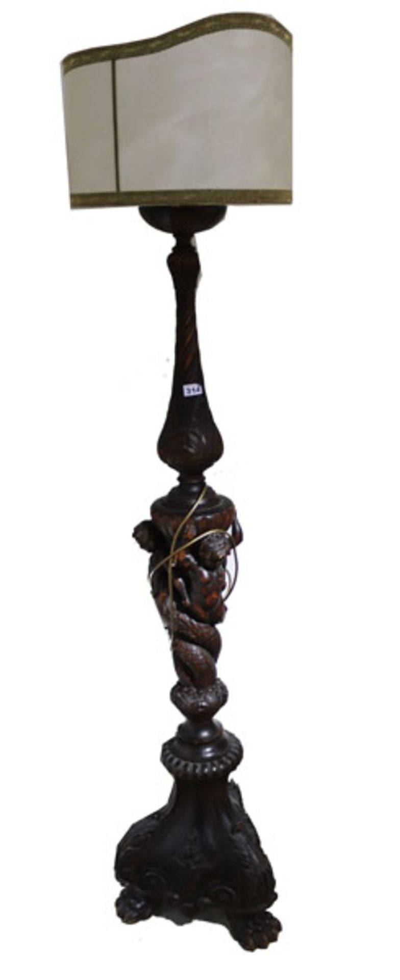 Holz Stehlampe, reich beschnitzt, teils figürlich, dunkel gebeizt, beiger Lampenschirm, H 193 cm,