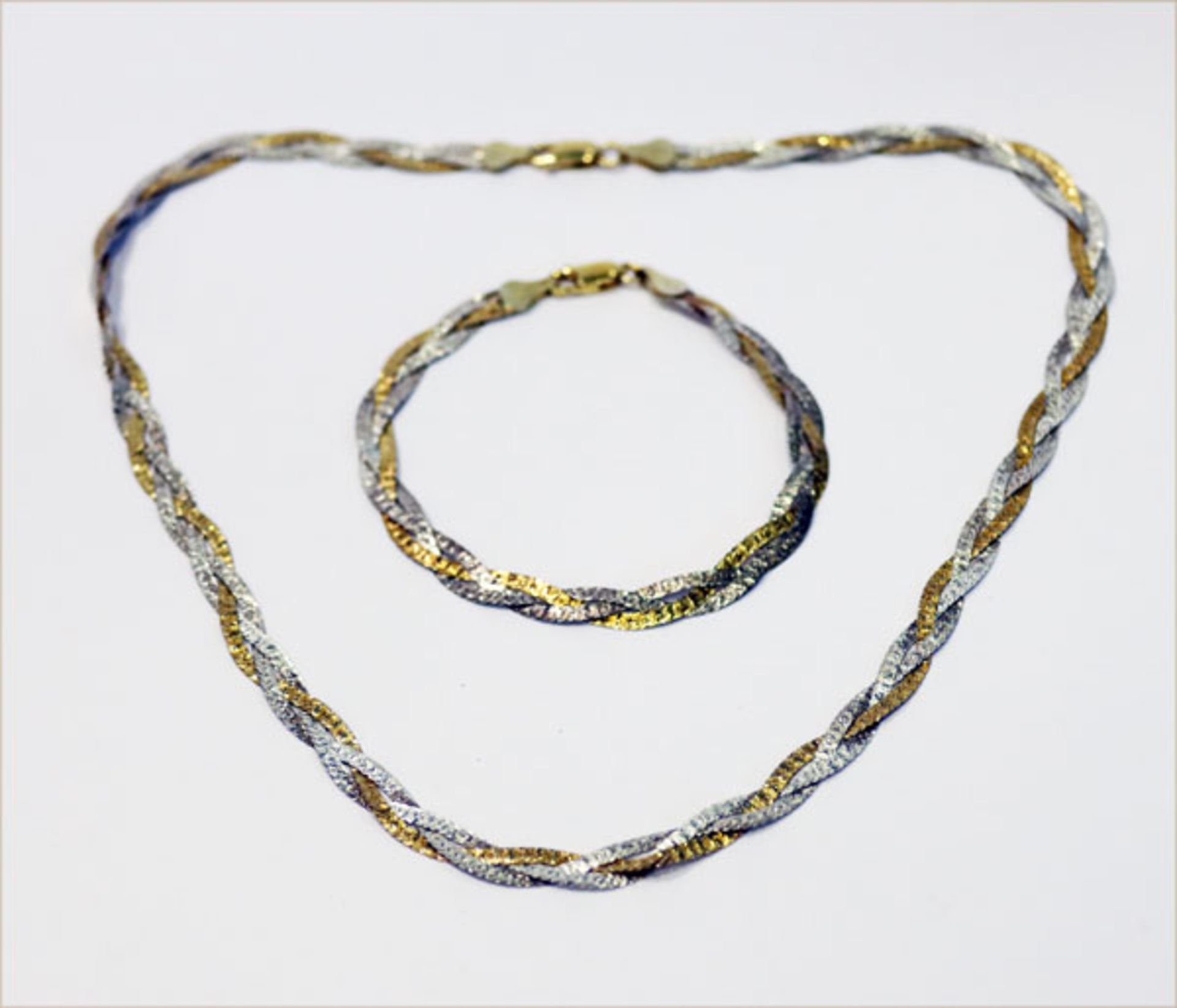 Silber, teils vergoldete Halskette und Armband, beides in Flechtdekor, L 42/ 16 cm, 12,8 gr.