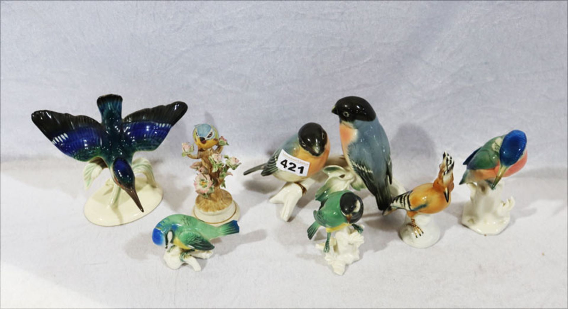 Konvolut von 7 Porzellanfiguren 'Vögel', teils Firma Enz, alle farbig glasiert, teils beschädigt und