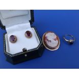 A pair of oval garnet set 9ct gold earrings, a cabochon set 9ct gold ring and an oval 9ct gold cameo