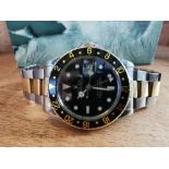 A boxed 1980/81 gent's stainless steel & gold Rolex GMT-Master bracelet wrist watch, having black