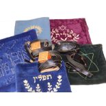 Four phylacteries/teffilin on leather straps, together a Jewish tallit (prayer shawl) with five