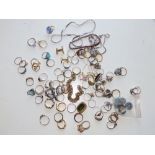 A quantity of silver & other rings and other costume jewellery.