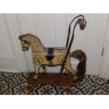 A Victorian painted wood push-along horse with hair mane & tail, 18" across base.