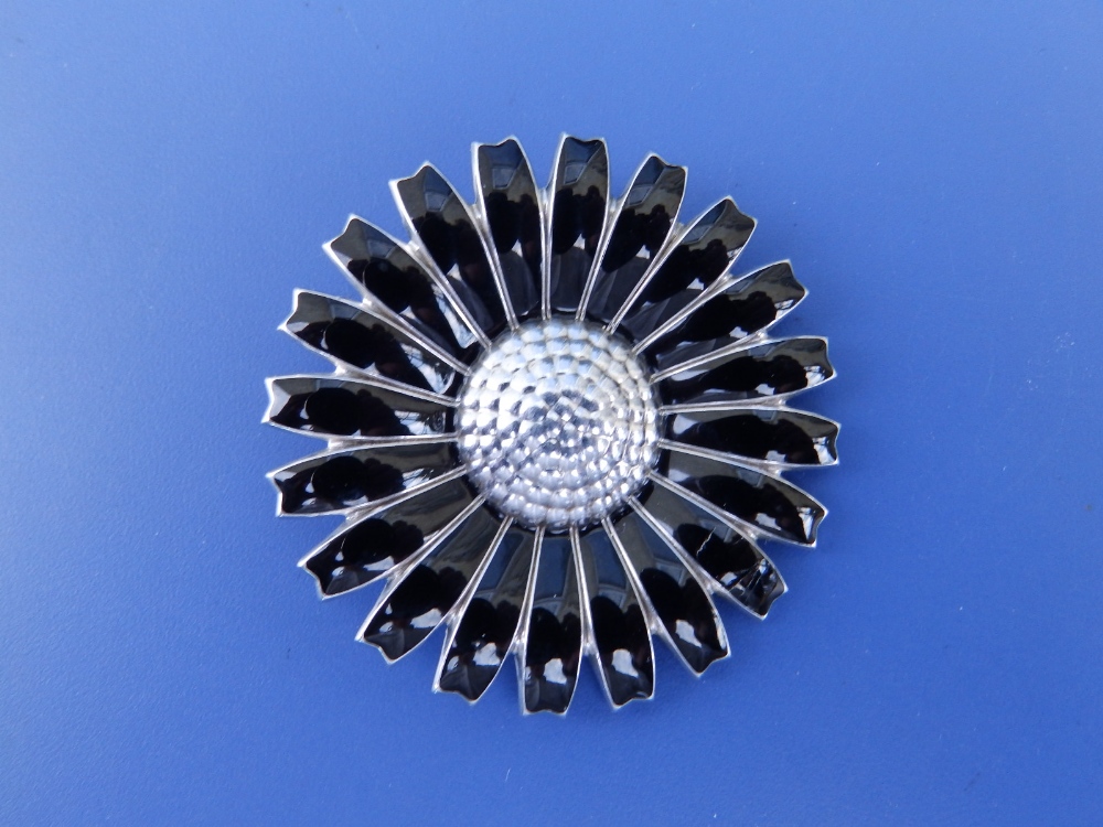 A Georg Jensen black enamelled silver daisy flowerhead brooch/pendant, 1.75" diameter.