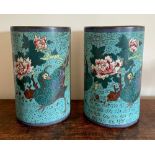 A pair of Chinese cloisonne enamel brush pots, each decorated with a peacock and large flower