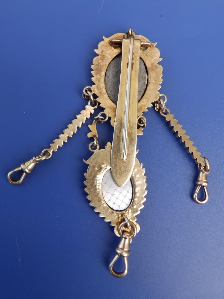 A gilt metal chatelaine in the 18thC style, set with two enamel painted porcelain figural plaques, - Image 4 of 4