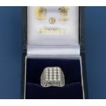A diamond pave set 18ct white gold ring in Benney box, the raised square setting having 82 round