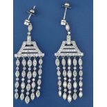 A boxed pair of art deco diamond millegrain set platinum drop earrings, each in the form of a bell