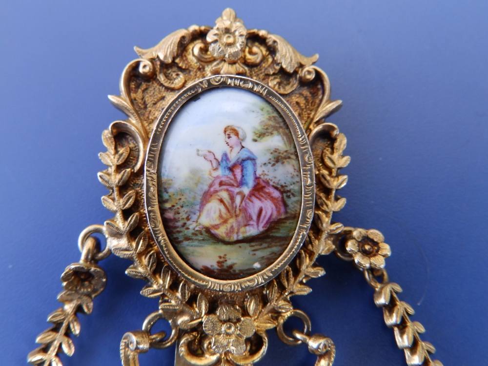 A gilt metal chatelaine in the 18thC style, set with two enamel painted porcelain figural plaques, - Image 2 of 4