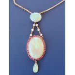 A late Victorian opal, ruby & pearl set pendant necklace in yellow metal, the principal oval