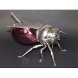 A continental silver plated bee honey pot with cranberry glass body and matching spoon, 6.75"