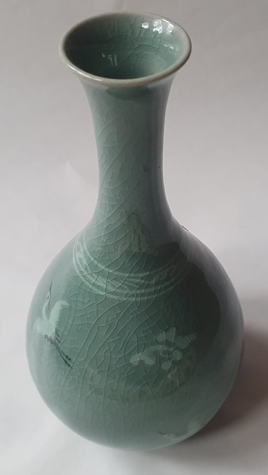 A Korean celadon glazed biottle vase decorated with a small crane & floral sprigs, 7.5" high. - Image 4 of 5