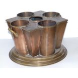 An art deco copper wine cooler by Peak & Co., to hold four bottles, 13" across.