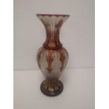 A 19thC Bohemian glass vase, the shoulders decorated with ruby red lappets and gilding, 12.5" high.