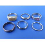 Three 9ct wedding bands and three other 9ct rings.